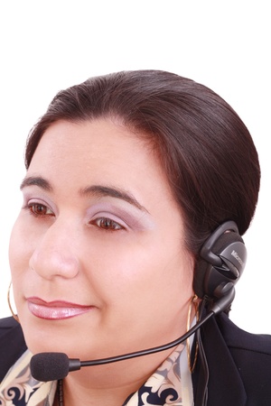 Young beautiful girl in headset,sitting at the desk tired, isolated on white backgroundの写真素材