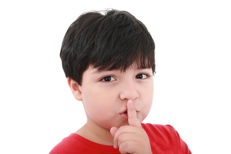 shh. secret - Young boy with his finger over his mouth の写真素材