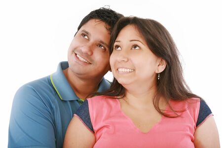 Closeup portrait of a happy couple looking at something interestingの写真素材