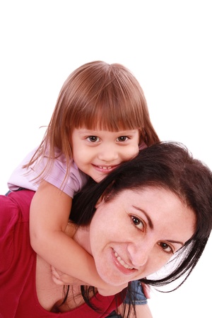 Mother and daughter smiling into the camera lensの写真素材