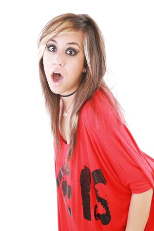Shocked trendy teenage girl posing mouth open 
の写真素材