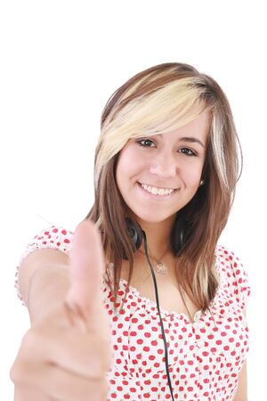 Smiling beautiful woman with thumbs up. Focus on the girlの写真素材