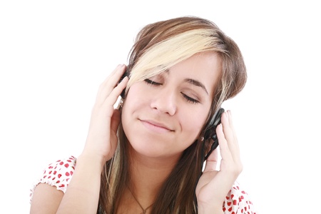 Woman listening to music and singing. Isolated on white background の写真素材