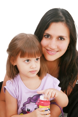 Young mother and daugther embracing の写真素材