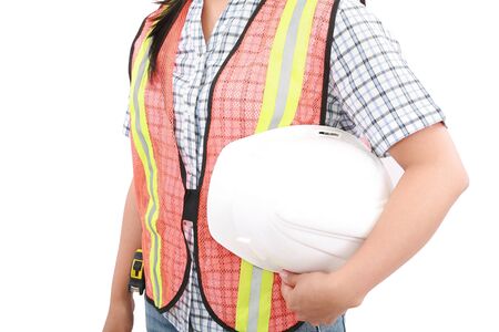 Engineer woman holding an helmet, isolated over white の写真素材
