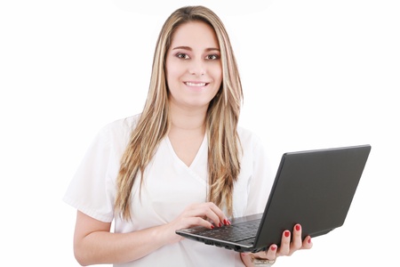 Beautiful caucasian doctor or nurse holding a laptop computerの写真素材