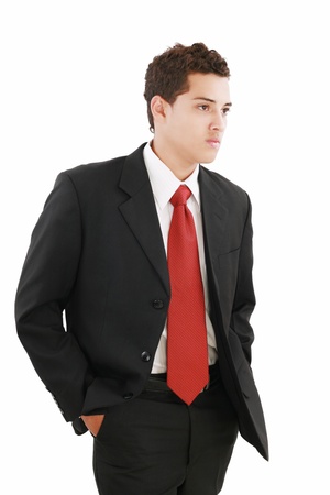 Young businessman over white background. Isolated fresh teenager in suit.の写真素材