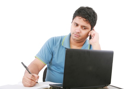 Man with cellphone and laptop, isolated on whiteの写真素材