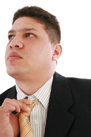 Business man fixing his tie, isolated over white 
の写真素材