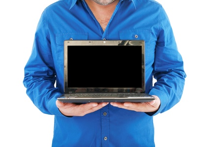 Businessman holding an open laptop. Isolated on white background 
の写真素材