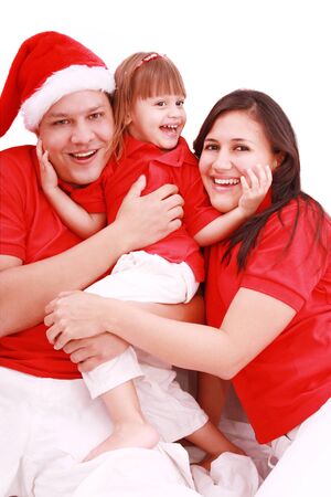 Portrait of happy family looking at camera and prepared for Christmasの写真素材