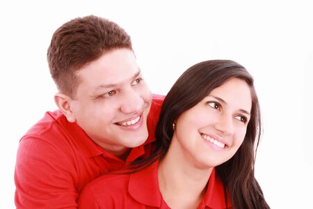 Portrait of a happy couple hugging each other and looking away - Copyspaceの写真素材