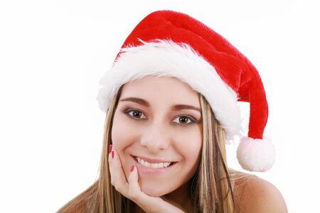 Portrait of beautiful woman wearing santa claus hat on white background 
の写真素材