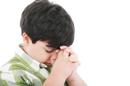 A boys prays earnestly to his creator in heaven 
の写真素材