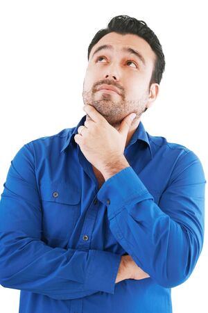 Young man in thoughtful pose. Isolated over white. 
の写真素材