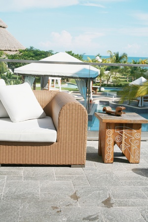 Backyard with modern sofa and end table of a beautiful mansion の写真素材