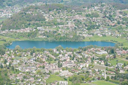 View from Monte Generoso down to Lugano and its lake in Switzerland の写真素材