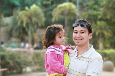 Father and daughter in parkの写真素材