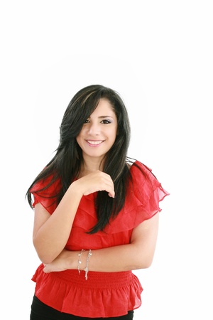 Portrait of a happy young business woman standing with folded hand against white background 
の写真素材