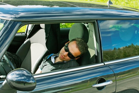 man sleeps in a car の写真素材