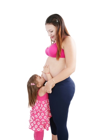 Nice Caucasian woman pregnant with her daughter on the background の写真素材