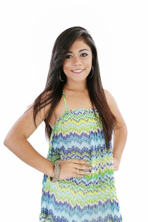 Portrait of a beautiful young woman looking happy against white backgroundの写真素材