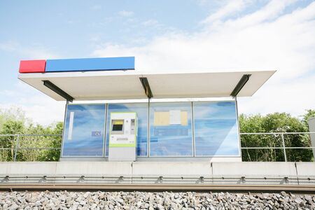 Two blue billboards at a train stopの写真素材
