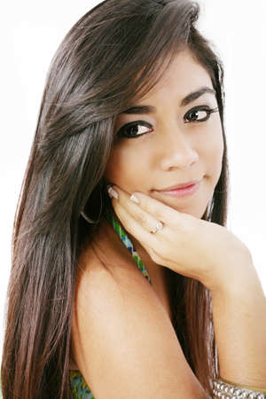 Sensual young woman with beautiful long brown hairs, posing isolated on whiteの写真素材