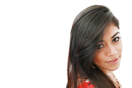 Potrait of an attractive young fashion model female smiling against white background の写真素材