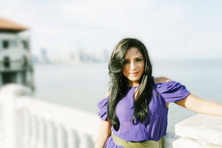 Beautiful lady posing in the beginning of the coastの写真素材