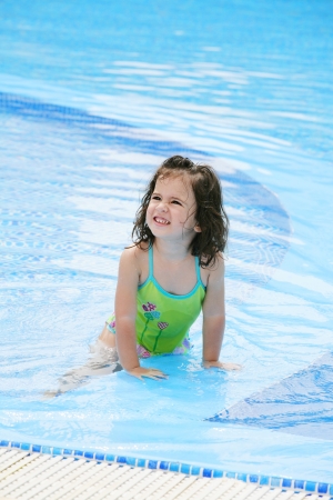 happy girl in the swimming in swimming suit の写真素材
