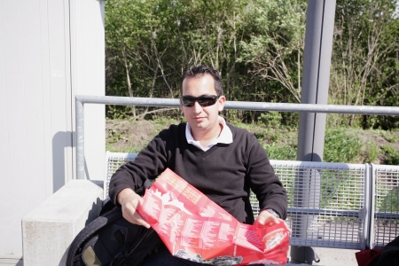A shot of a handsome caucasian traveling man reading a mapの写真素材