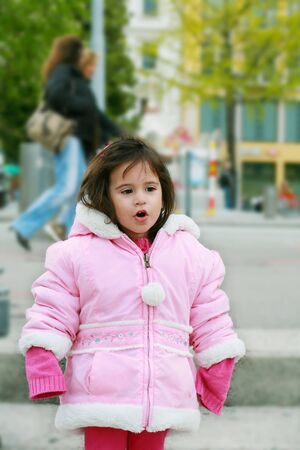 portrait young girl walking in winter parkの写真素材