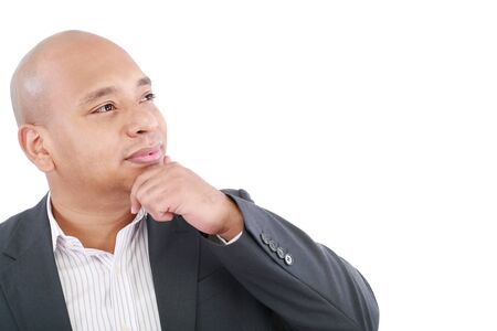 Portrait of a smiling young businessman looking at copyspace against white - Isolated の写真素材