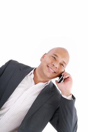 Business man talking on cell phone. Pleasant Look. One White. Business Casual Lookの写真素材