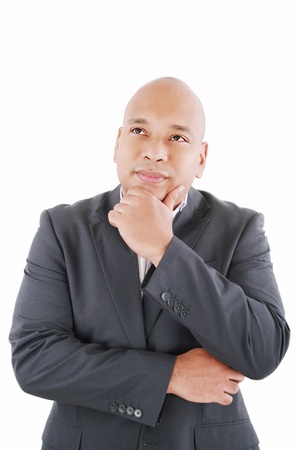 Portrait of handsome young thoughtful businessman isolated over white backgroundの写真素材