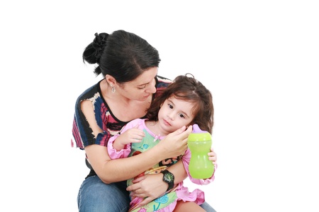 mother is holding a sick daughter in her arms の写真素材