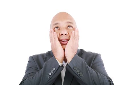 Shocked businessman isolated on a white background. の写真素材