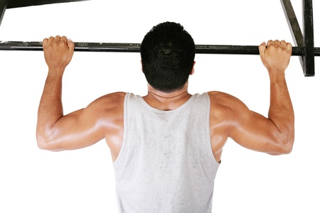 very power athletic guy, execute exercise tightening on horizontal bar, isolated on whiteの写真素材