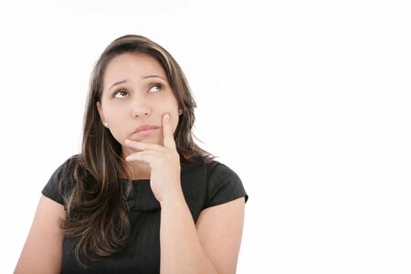 Young beautiful business woman thinking / making choice, isolated on white の写真素材