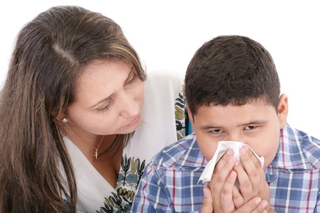 Child blowing nose. Child with tissue. catarrh or allergy の写真素材