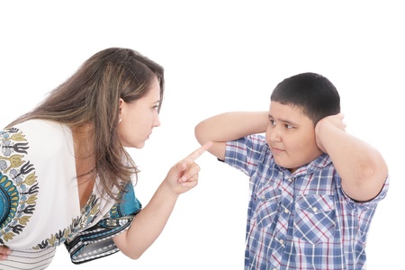 Mother scolding her son with pointed finger の写真素材
