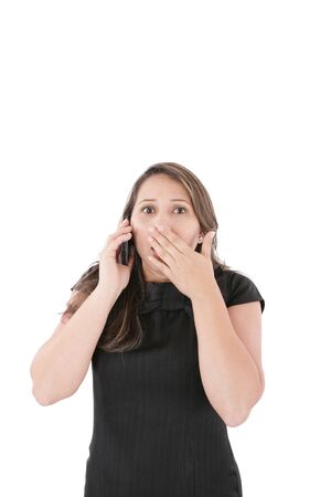 Portrait of woman making a phone call against a white background の写真素材