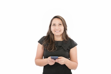 Portrait of happy young business woman text messaging on mobile phone smiling with bracesの写真素材