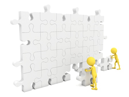Men putting on a wall a piece missing の写真素材