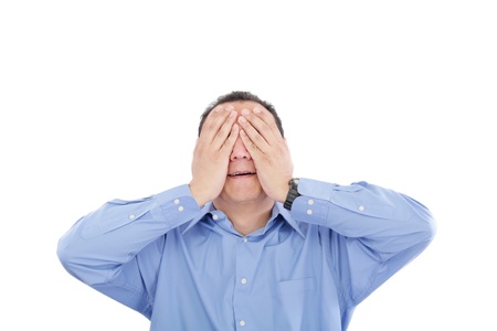 Portrait of a young business man depressed from work against white background の写真素材