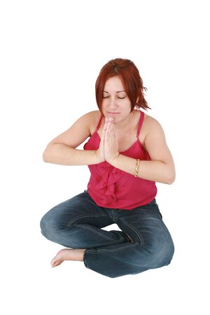 Calm woman doing relaxing yoga exercises の写真素材