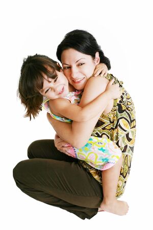 Closeup portrait of mother and daughter in white studioの写真素材