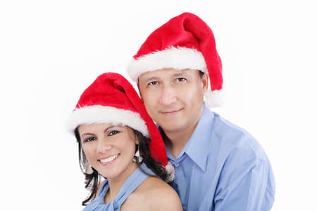 Young happy lovely couple wishing a merry christmasの写真素材