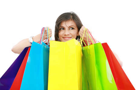 Beautiful shopping woman holding bags  isolated over white backgroungの写真素材